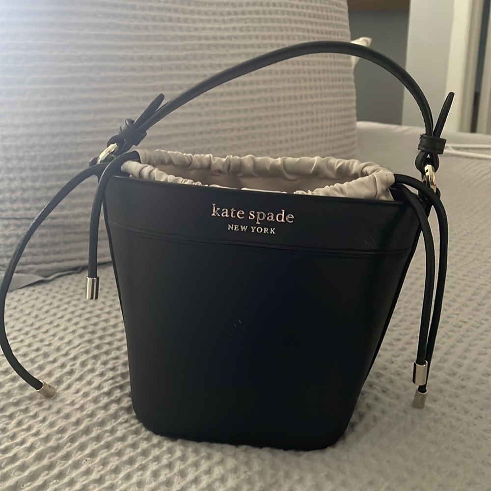 Black Kate Spade bucket bag.
